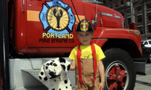 Child and Dalmatian. Photo Provided by Portland Fire Engine Co. Tours
