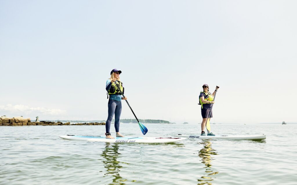 Paddle board duo. Photo credit: Lone Spruce Creative, courtesy of Maine Office of Tourism
