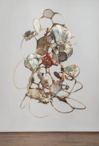 Jodi Corella, A Figment of, 2024, Wire armature, cheesecloth, tea stained rope, family photos printed on silk, assorted textiles and yarn, 57 x 45 x 40 inches