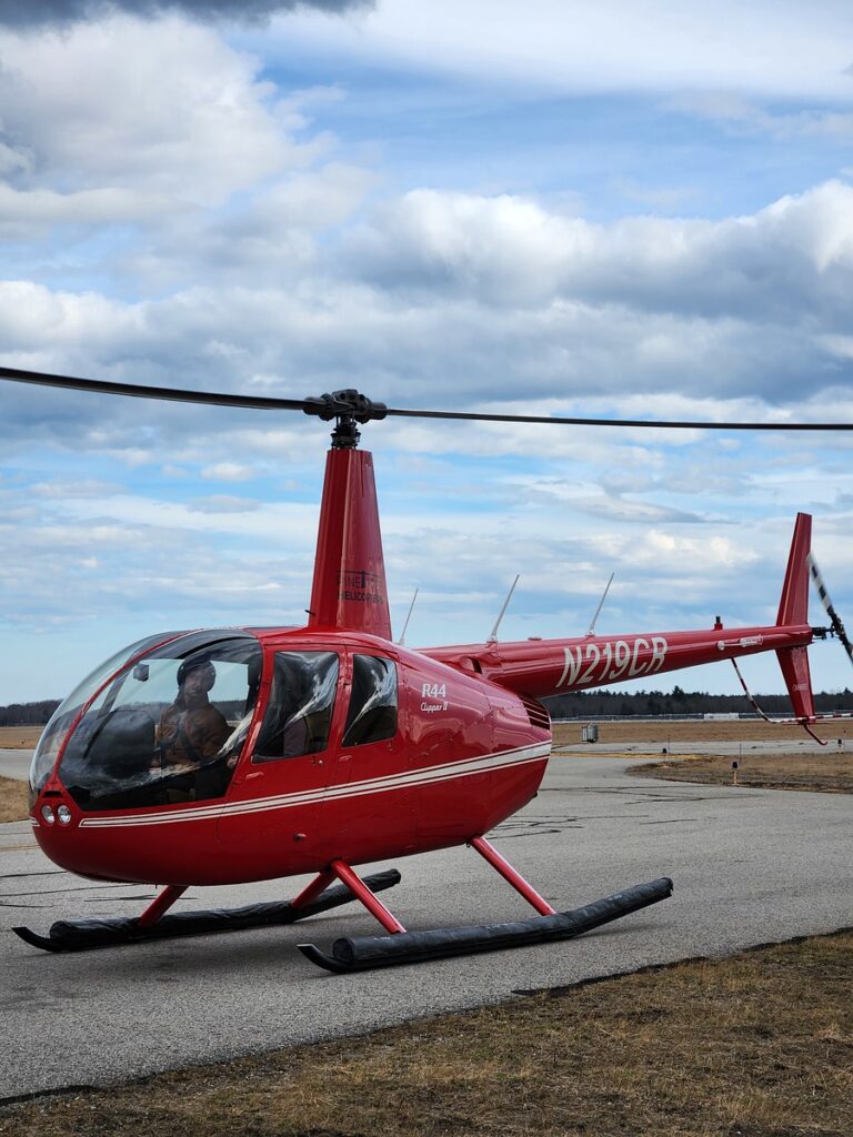 Pilot in Helicopter. Photo Credit: Pine Tree Helicopters Pilot in Helicopter. Photo Credit: Pine Tree Helicopters