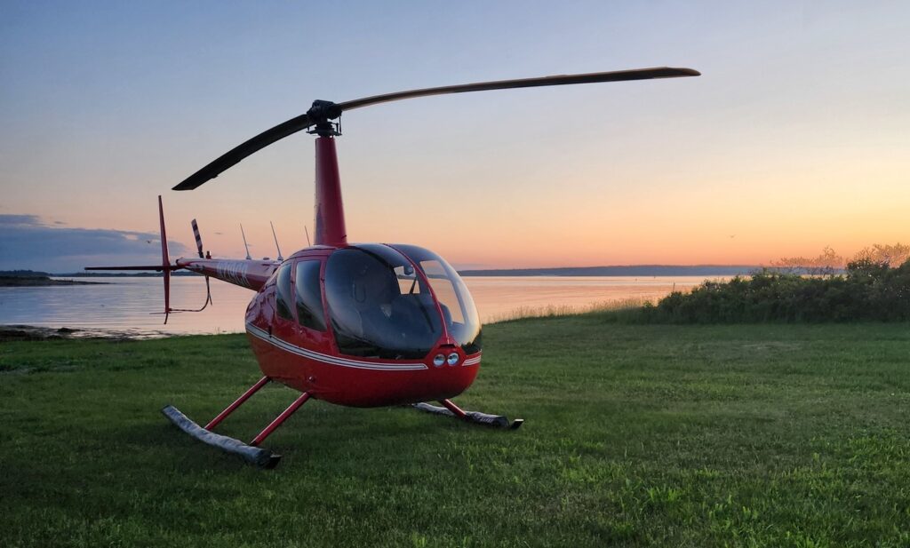 Helicopter at Sunset. Photo Credit: Pine Tree Helicopters Helicopter at Sunset. Photo Credit: Pine Tree Helicopters