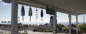 The Lobster Shack building with hanging buoys; Photo Credit: The Lobster Shack at Two Lights