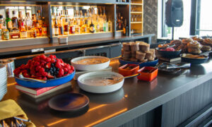 Breakfast buffet with red berries spread on bar; Photo Credit: Lauren Peters at Visit Portland
