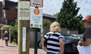 People waiting to board the city loop shuttle at stop number 5; Photo Credit: Angie Helton