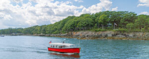 Boat sitting in Casco Bay near island; Photo Credit: Peter G. Morneau Photography