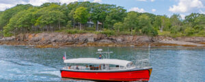 Boat sitting in Casco Bay near island; Photo Credit: Peter G. Morneau Photography
