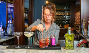 Bartender making drinks; Photo Credit: Lauren Peters at Visit Portland