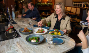 Erin and Lynn eating dinner; Photo Credit: Lauren Peters at Visit Portland