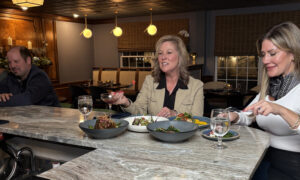 Erin and Lynn eating dinner; Photo Credit: Lauren Peters at Visit Portland