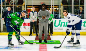 Posing for the puck drop before a hockey game; Photo Credit: Maine Mariners Photography Team