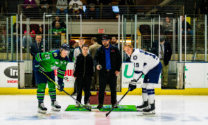 Posing for the puck drop before a hockey game; Photo Credit: Maine Mariners Photography Team