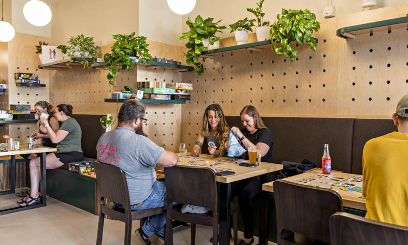 Customers enjoying games; Photo Credit: Amanda Huebner Photography