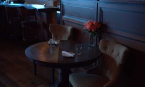 Dinning table with flowers in Boone's; Photo Credit: Digital Edge