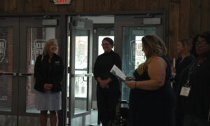 People listening to guest speaker; Photo Credit: Digital Edge