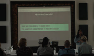 People focusing during presentation; Photo Credit: Digital Edge