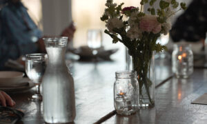 Flowers on a restaurant table; Photo Credit: Digital Edge