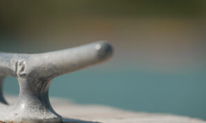 Closeup of boat anchor on dock; Photo Credit: Digital Edge