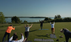 Doing yoga in the park overlooking Casco Bay; Photo Credit: Digital Edge