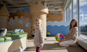 Kid playing in a children's castle; Photo Credit: Zack Bowen