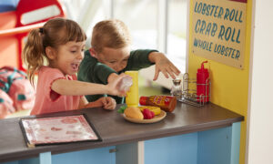 Kids playing with interactive restaurant; Photo Credit: Zack Bowen