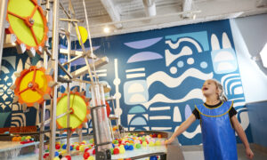 Kids playing with interactive water station; Photo Credit: Zack Bowen