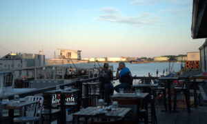 Couple enjoying the view on a deck; Photo Credit: Digital Edge