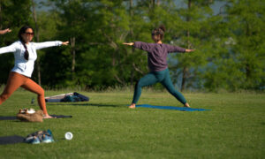 Doing yoga in the park; Photo Credit: Digital Edge