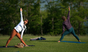 Doing yoga in the park; Photo Credit: Digital Edge