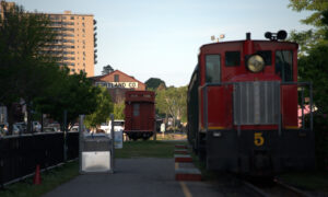 Red trains on Portland's waterfront; Photo Credit: Digital Edge