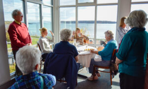 Group listening to speakers at McKernan Inn; Photo Credit: Lauren Witt at Visit Portland