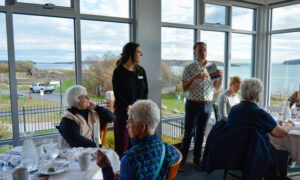 Group listening to speakers at McKernan Inn; Photo Credit: Lauren Witt at Visit Portland