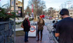 Women walking and chatting in Freeport; Photo Credit: Lauren Witt at Visit Portland
