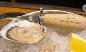 Oyster and shucker; Photo Credit: Lauren Witt at Visit Portland