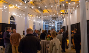 Group listening to a speaker present; Photo Credit: Lauren Witt at Visit Portland