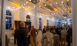 Group listening to a speaker present; Photo Credit: Lauren Witt at Visit Portland