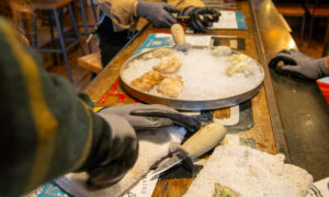 Shucking Oysters at Maine Oyster Co. Photo Credit: Lauren Witt at Visit Portland