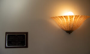 Unique wall sconce and plaque on hotel wall; Photo Credit: Lauren Witt at Visit Portland