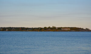 Fortland in Casco Bay at sunset; Photo Credit: Lauren Witt at Visit Portland