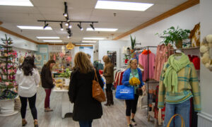 Women shopping in Freeport store; Photo Credit: Lauren Witt at Visit Portland