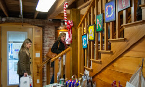 Women shopping through candy shop in Freeport; Photo Credit: Lauren Witt at Visit Portland