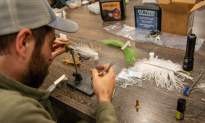 Rising Tide Fly fishing making; Photo Credit: Lauren Witt at Visit Portland