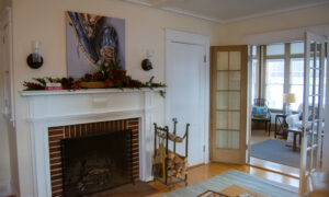 LL Bean guest house living room with wood fireplace; Photo Credit: Lauren Witt at Visit Portland