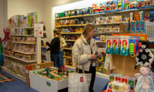 People shopping for kids toys; Photo Credit: Lauren Witt at Visit Portland