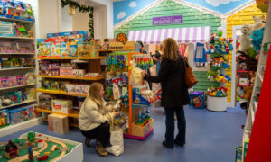 People shopping for kids toys; Photo Credit: Lauren Witt at Visit Portland