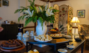 Daily tea setup with white lilies; Photo Credit: Lauren Witt at Visit Portland