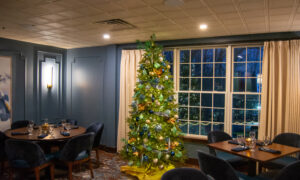 Christmas tree in restaurant dinning room; Photo Credit: Lauren Witt at Visit Portland