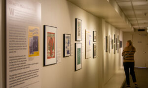 Woman admiring history exhibit; Photo Credit: Lauren Witt at Visit Portland