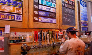 Bartender pouring beers at Shipyard; Photo Credit: Lauren Witt at Visit Portland