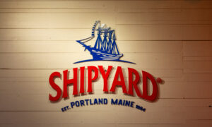 Blue and red shipyard logo; Photo Credit: Lauren Witt at Visit Portland