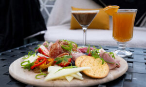 Drinks and cheese board inside cozy igloo; Photo credit: Mitch Powers from Powerhouse Media